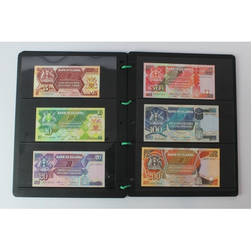 438 - Uganda (42), an Uncirculated group in album pages, 5 Shillings, 10 Shillings, 20 Shillings, 50 Shill... 