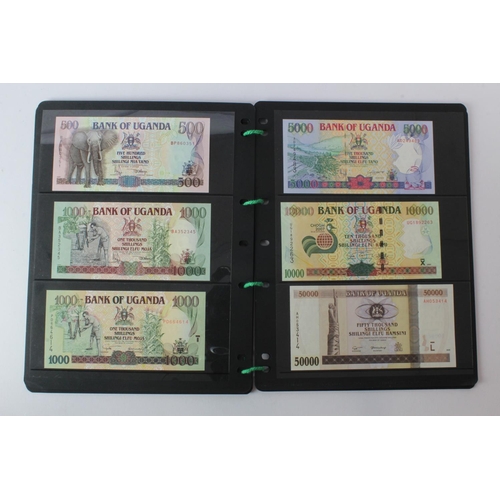 438 - Uganda (42), an Uncirculated group in album pages, 5 Shillings, 10 Shillings, 20 Shillings, 50 Shill... 