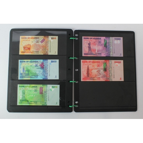 438 - Uganda (42), an Uncirculated group in album pages, 5 Shillings, 10 Shillings, 20 Shillings, 50 Shill... 