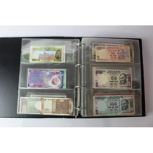 474 - World (178) an Uncirculated collection of world notes in album, all different (some same design and ... 