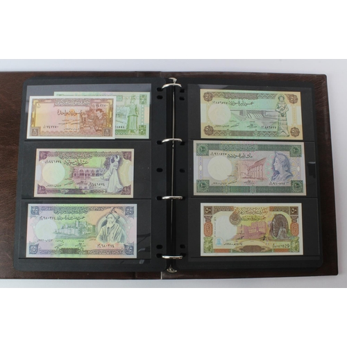 499 - World, Middle East (125) an Uncirculated group in album comprising Bahrain, Iran, Iraq, Jordan, Kuwa... 