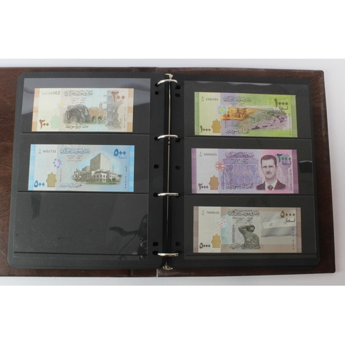 499 - World, Middle East (125) an Uncirculated group in album comprising Bahrain, Iran, Iraq, Jordan, Kuwa... 