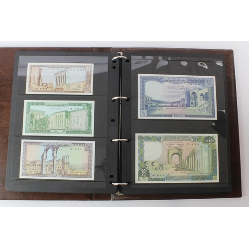 499 - World, Middle East (125) an Uncirculated group in album comprising Bahrain, Iran, Iraq, Jordan, Kuwa... 