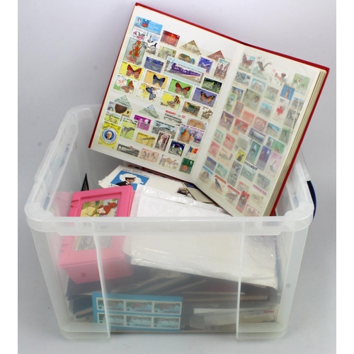 107 - Large clear plastic crate with a varied range of World material, loose in packets and several stockb... 