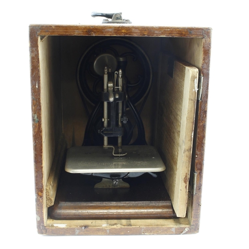 1097 - Wilcox & Gibbs sewing machine, height 25.5cm, length 32cm approx., contained in original wooden case... 