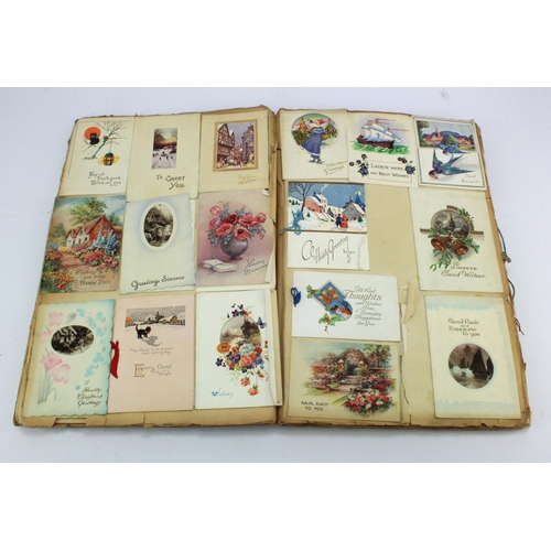 566 - Large scrap album, circa early 20th Century, filled throughout with greetings cards, 26cm x 40cm app... 