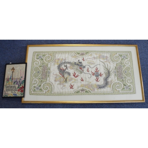 654 - Large embroidered silk picture depicting a Chinese dragon, framed and glazed, total size 103cm x 54c... 