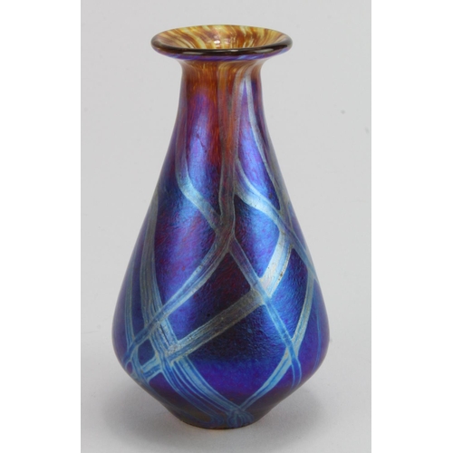 682 - Carin Von Drehle. Iridescent blue trailed bud vase, signed along base edge. Made during her time at ... 