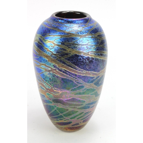 731 - Peter Layton, (B.1937) Iridescent blue studio glass vase, signed to bottom edge and dated 1987. Heig... 