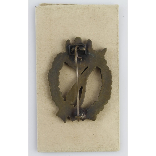 1141 - German 3rd Reich Infantry Assault Badge in paper packet of issue. Badge maker marked 'R.S.'.