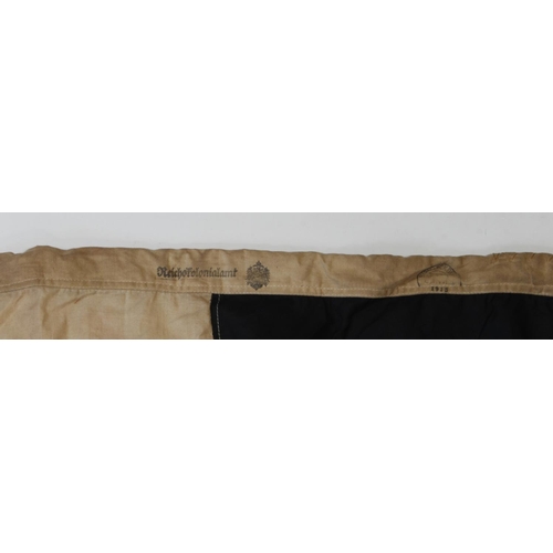 1371 - Imperial German Colonial flag, 5 feet long, interesting edge stamps, 1915 dated, service wear.