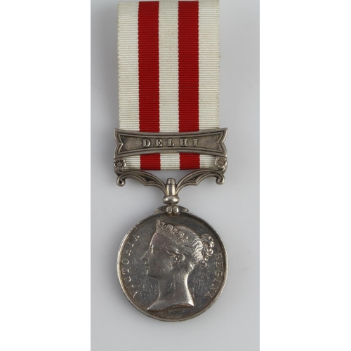 1392 - Indian Mutiny Medal 1857 with Delhi clasp (Color-Serjt T, Callaghan. 61st Regt). Rank partially corr... 