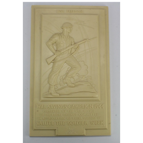 1592 - WW2 original Bakelite wall plaque depicting an advancing soldier with text 