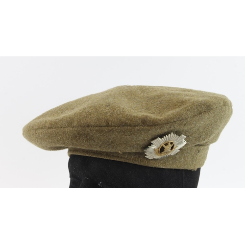 1604 - WW2 Scottish 1941 dated bonnet with badge to the Royal Scots with owners name inside E .G. Lee.