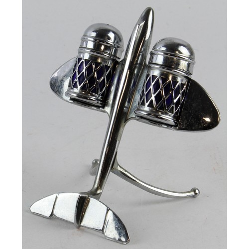 1079 - Silver plated salt & pepper cruet set in the form of an aeroplane (Reg. no. 876205), both with blue ... 