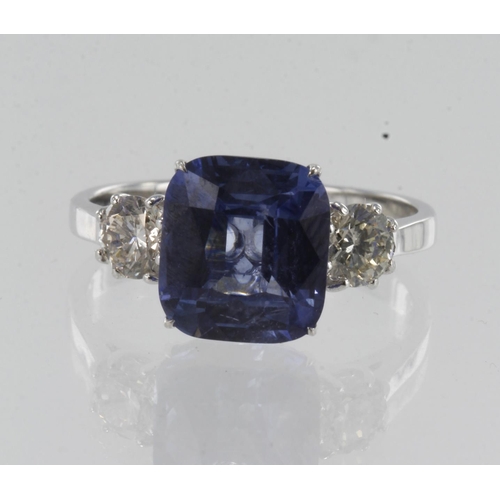 10 - White gold (tests 18ct) diamond and sapphire trilogy ring, one cushion sapphire measures approx. 9mm... 