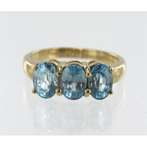 119 - 9ct yellow gold Ratanakiri zircon trilogy ring, three oval Cambodian zircons TGW 3.493ct, complete w... 