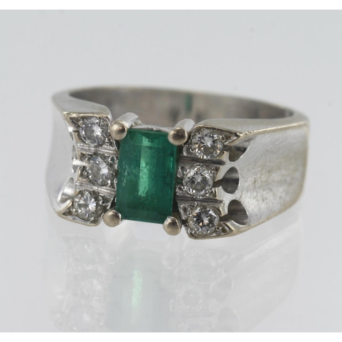 122 - White gold (tests 18ct) diamond and emerald ring, one baguette cut emerald approx. 0.90ct, measuring... 