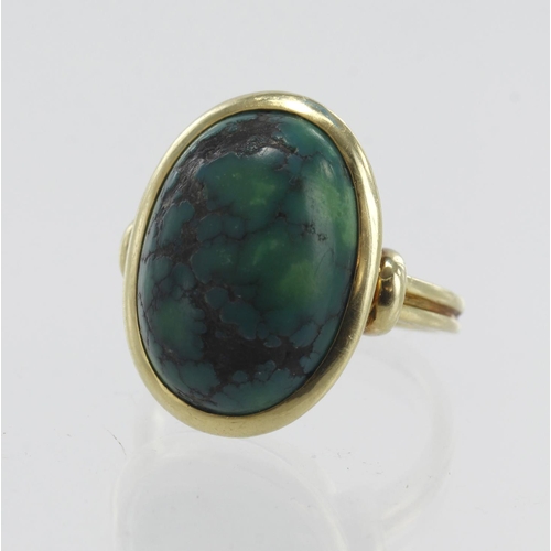 123 - Yellow gold (tests 14ct) turquoise dress ring, one cabochon turquoise measures approx. 17.5mm x 12.6... 