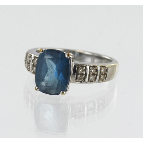 124 - 9ct white gold diamond and London blue topaz ring, one topaz measuring 9mm x 7mm, flanked with six d... 