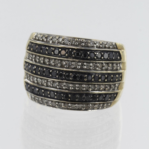 142 - 9ct yellow gold diamond and black diamond domed dress ring, TDW approx. 1.20ct, head measures 17mm, ... 