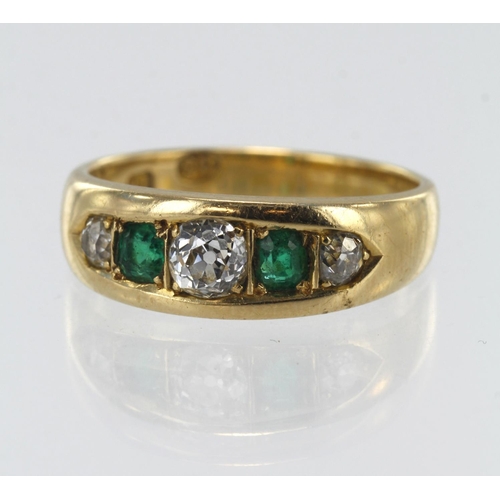 151 - Yellow gold (tests 18ct) diamond and emerald five stone ring, two step cut emeralds approx. 3mm x 3m... 