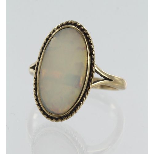 156 - Yellow gold (tests 9ct) opal dress ring, oval opal measures approx. 17mm x 9mm, finger size O, weigh... 