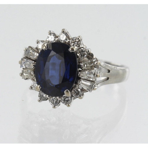 159 - White gold (tests 14ct) diamond and sapphire cluster ring, oval sapphire measures approx. 9.5mm x 7.... 