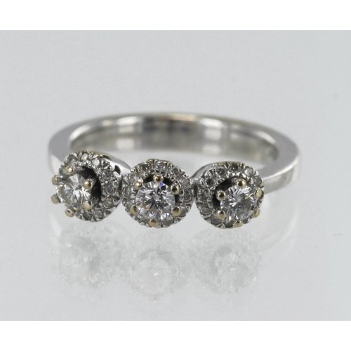 177 - White gold (tests 18ct) diamond triple cluster ring, TDW approx. 0.30ct, finger size N/O, weight 6.9... 