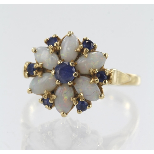 194 - 14ct yellow gold opal and sapphire cluster ring, six oval cabochon opals measuring approx. 5mm x 3mm... 