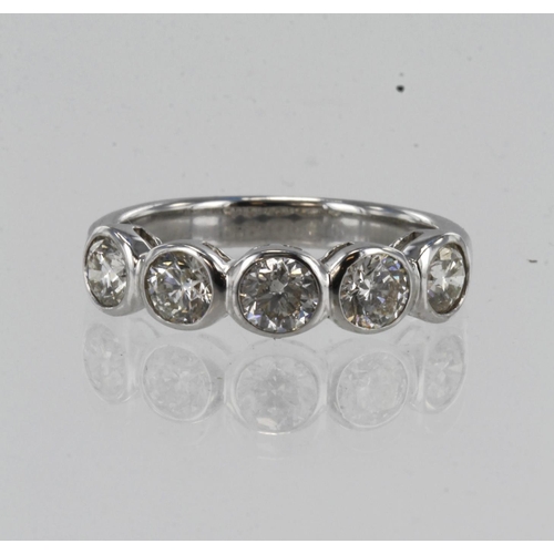 205 - White gold (tests 18ct) diamond ring, five round brilliant cuts approx. 1.35ct, bezel setting, finge... 