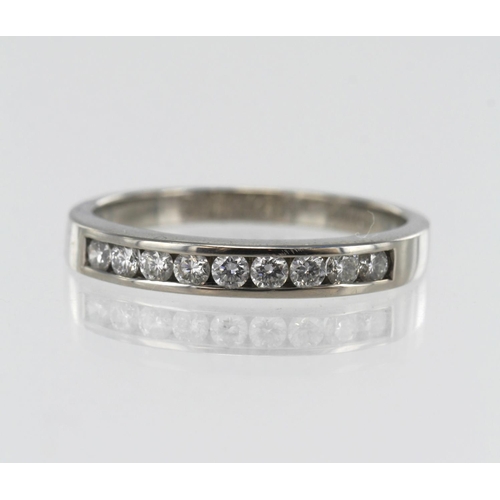 30 - Palladium diamond half eternity ring, nine round brilliant cut diamonds TDW approx 0.31ct, channel s... 