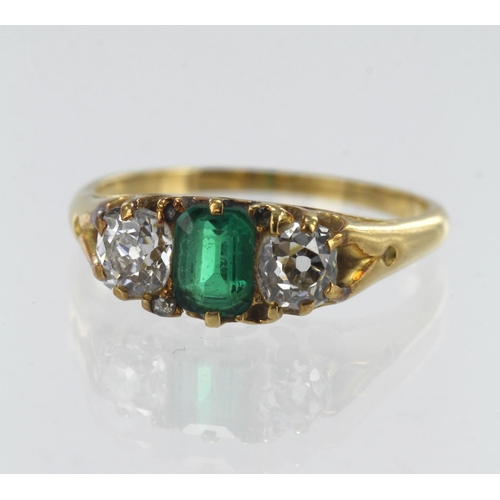 31 - Yellow gold (tests 18ct) vintage emerald and diamond trilogy ring, one step cut emerald measuring 6m... 