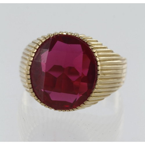 35 - 18ct yellow gold synthetic ruby signet ring, checker cut syn. ruby measures 16mm x 14mm, finger size... 