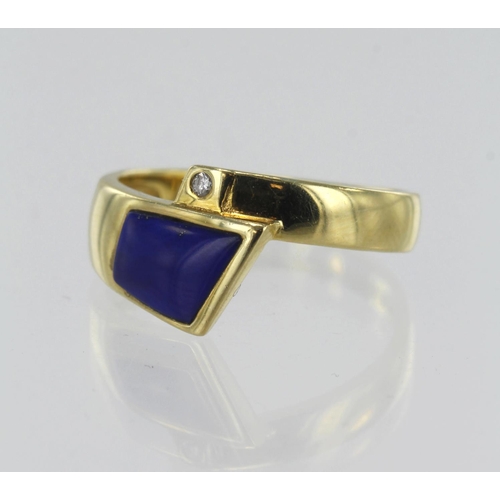41 - 14ct yellow gold contemporary crossover dress ring, set with one 0.015ct diamond and lapis lazuli, f... 