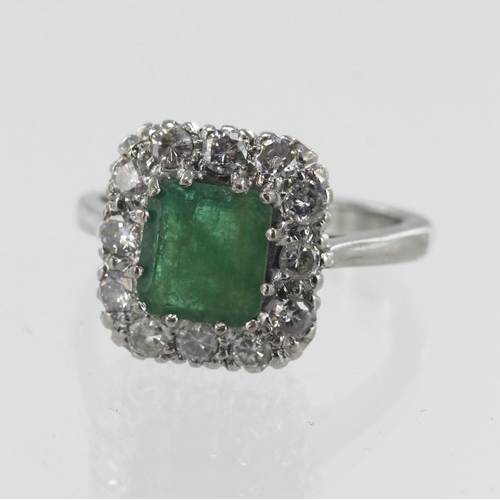 46 - 18ct White gold diamond and emerald cluster ring, one square step cut measures approx. 7.5mm x 7mm, ... 