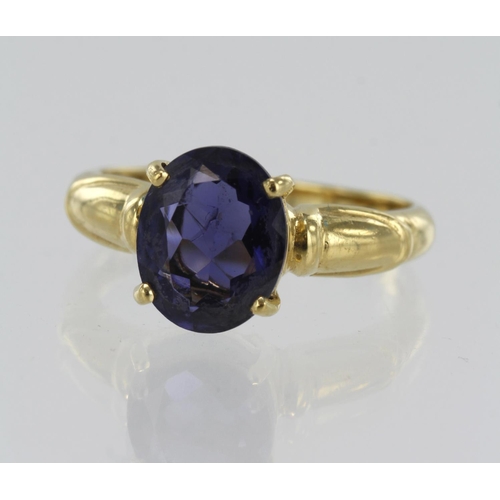 50 - 18ct yellow gold iolite solitaire ring, one oval iolite measuring 10mm x 8mm, four claw setting, fin... 