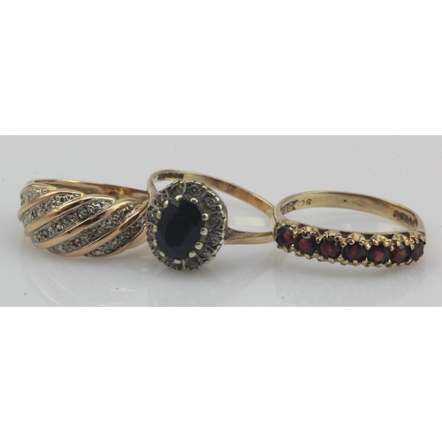 542 - Three 9ct gold/tests 9ct dress rings, stones include diamond, sapphire and garnet, finger sizes J/K,... 