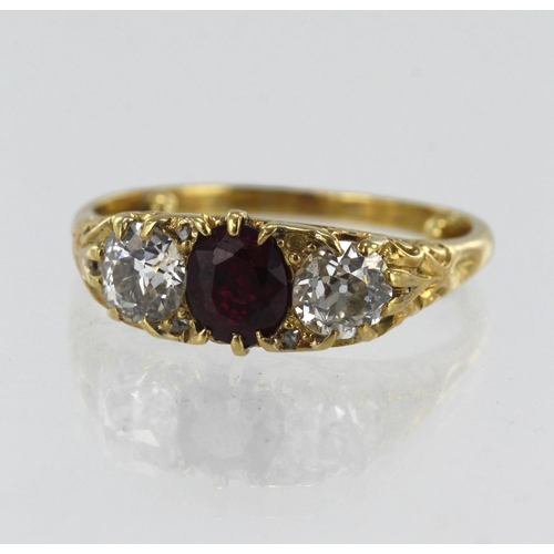 62 - Yellow gold (tests 18ct) diamond and ruby trilogy ring, one flux filled ruby measuring approx. 6mm x... 