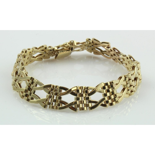 620 - 9ct yellow gold crossover and panther linked bracelet, width 11mm, length 8