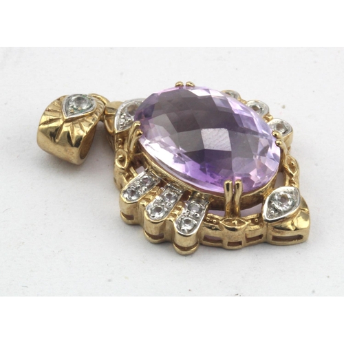 626 - 9ct yellow gold amethyst and white topaz pendant, one 9ct oval checker cut amethyst , with fifteen t... 