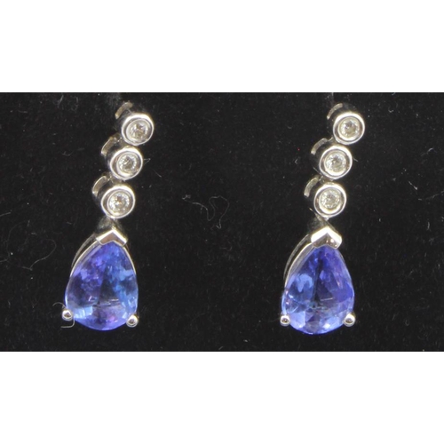 631 - 18ct white gold diamond and tanzanite drop earrings, one pear shaped tanzanite approx. 6.5mm x 4.5mm... 