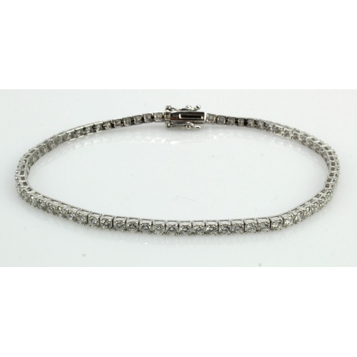 634 - White gold (tests 18ct) diamond tennis bracelet, round brilliant cuts TDW approx. 2.19ct, box clasp,... 