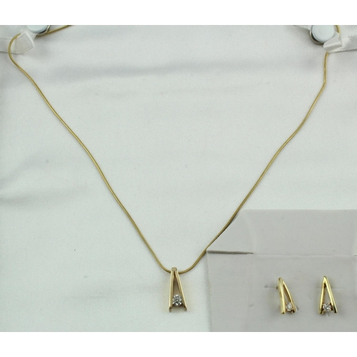 640 - Yellow gold (tests 14ct) diamond necklace and earring set, pendant set with one round brilliant cut ... 