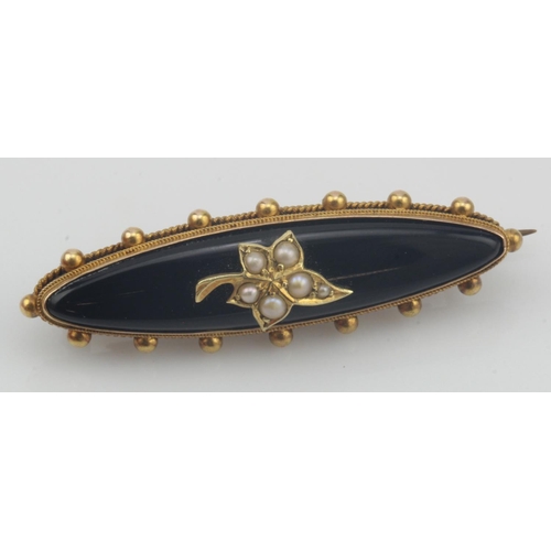 648 - Yellow gold (tests 15ct) Victorian mourning brooch, set with onyx and a half pearl ivy leaf motif, c... 