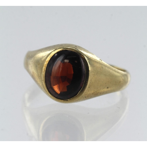 65 - 9ct yellow gold garnet signet ring, oval cabochon garnet with faceted pavilion measures 10mm x 7.5mm... 