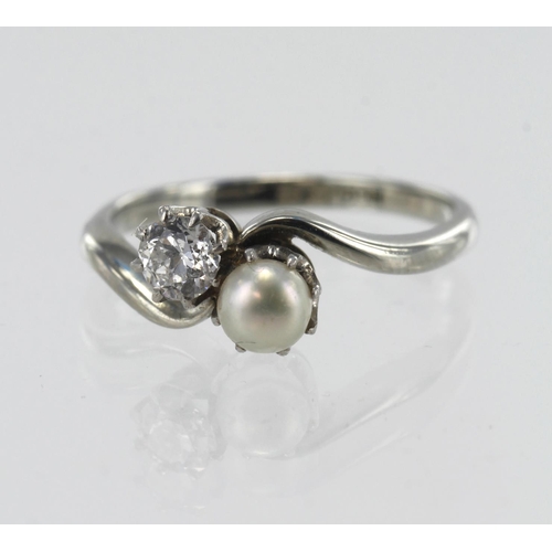 80 - White gold (tests 18ct) vintage diamond and pearl Toi Et Moi ring, one old cut diamond approx. 0.17c... 