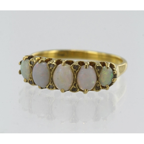 81 - Yellow gold (tests 18ct) diamond and opal boat shaped ring, five graduating opals, principle measure... 