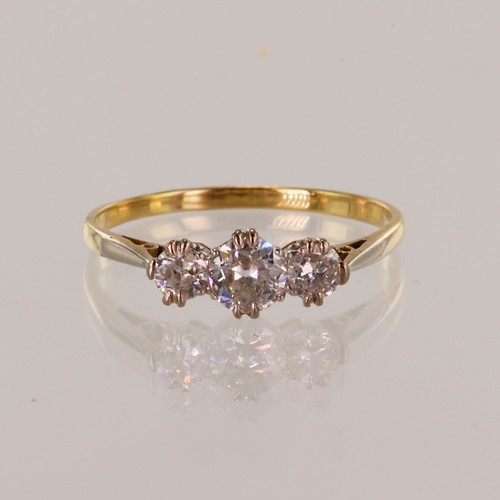 138 - Yellow gold (tests 18ct) diamond trilogy ring, three graduating old cut diamonds, principle diamond ... 