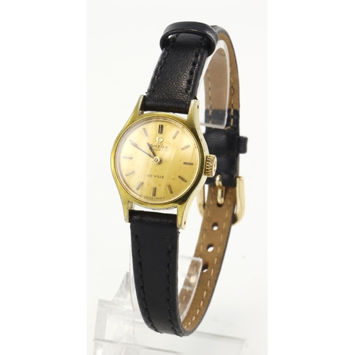 166 - Ladies gold plated Omega De Ville Automatic wristwatch. The gilt dial with baton markers and black h... 